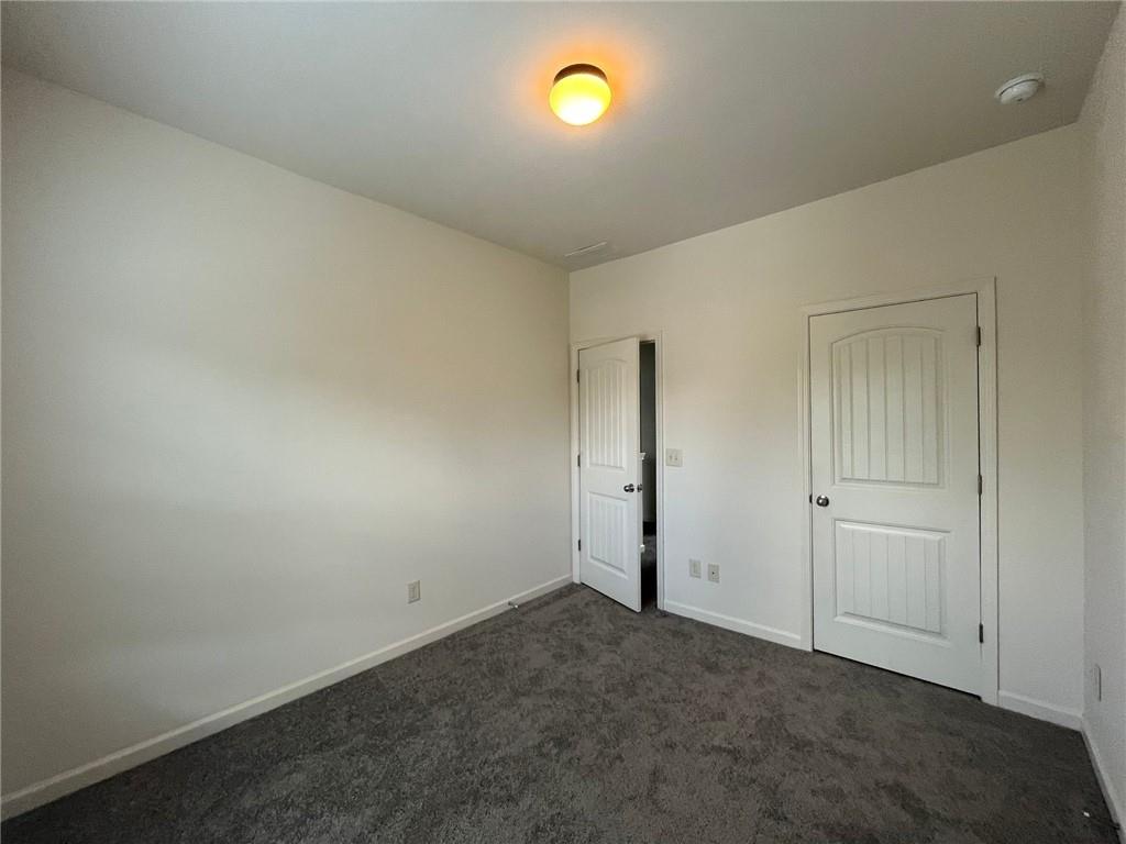 61 Howard Avenue Cartersville, GA 30121 - Photo 12 of 19 an empty room with a window