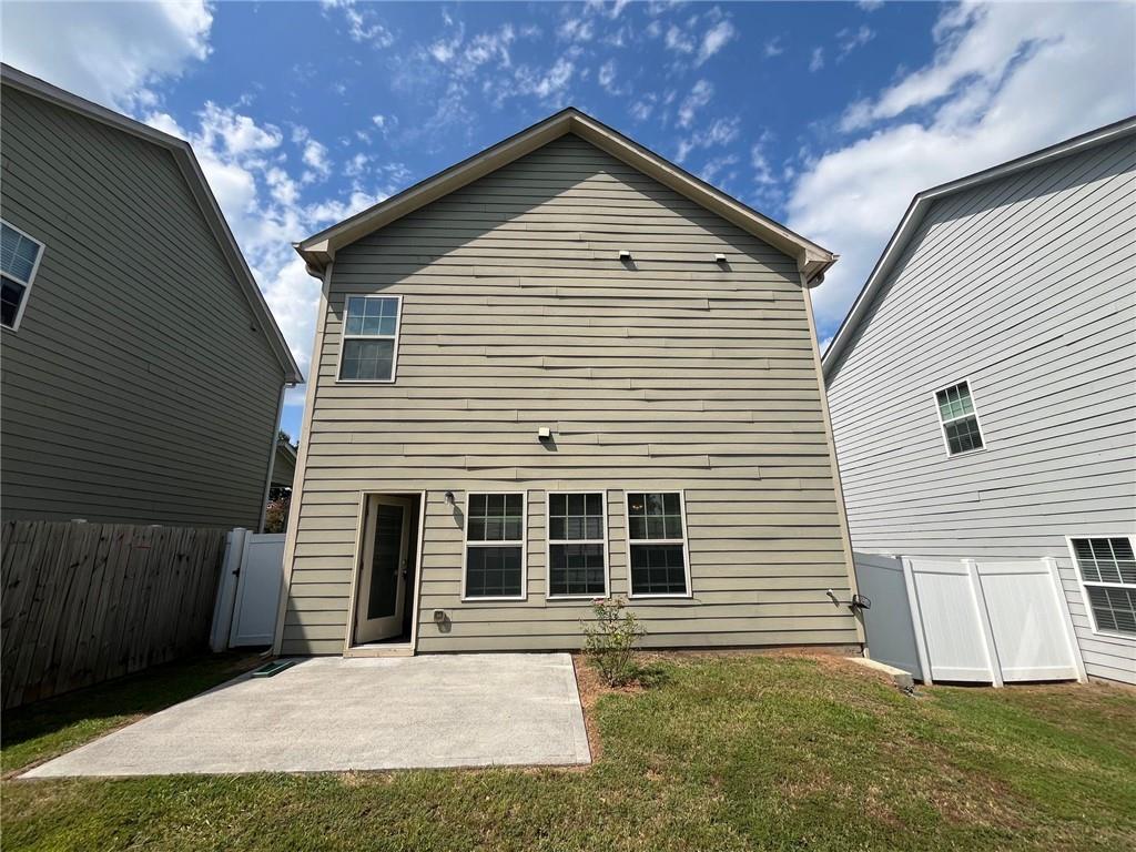 61 Howard Avenue Cartersville, GA 30121 - Photo 17 of 19 a front view of a house with a yard