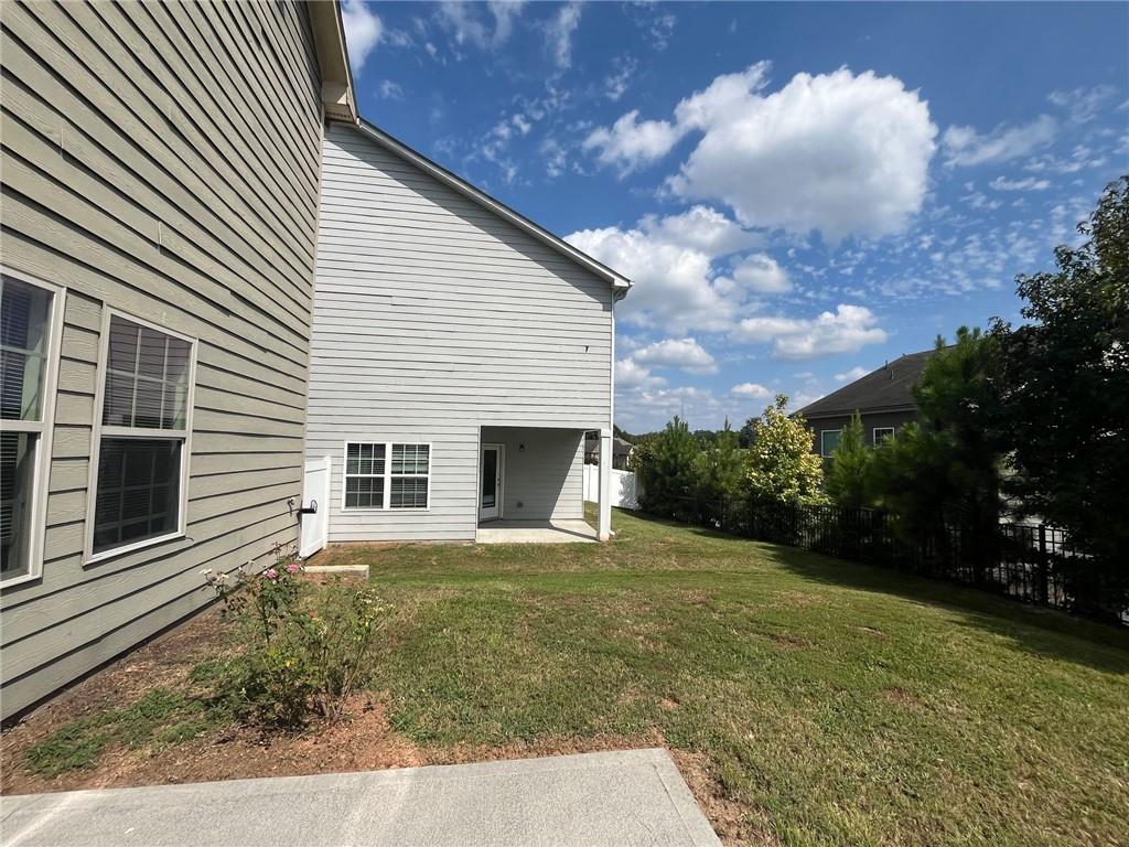 61 Howard Avenue Cartersville, GA 30121 - Photo 18 of 19 a view of a house with backyard and garden