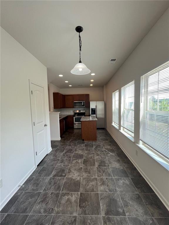 61 Howard Avenue Cartersville, GA 30121 - Photo 4 of 19 a large room with a large window and furniture