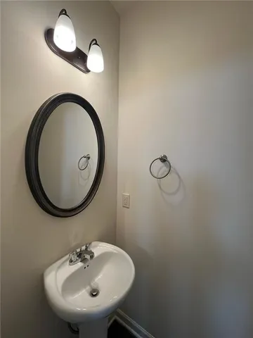 a bathroom with a sink and mirror