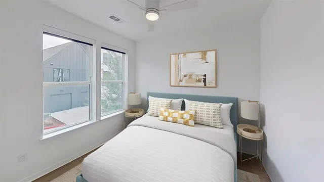 a bedroom with a bed and a window