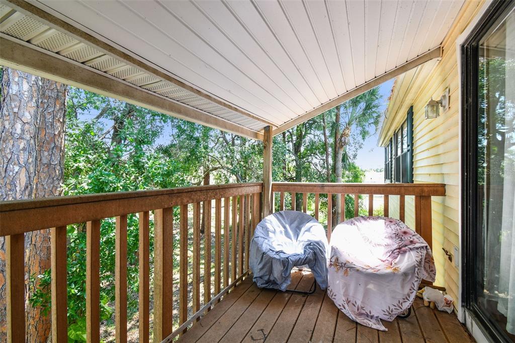 134 Sycamore Lane, Unit H Oldsmar, FL 34677 - Photo 11 of 44 a view of a two chair in the balcony