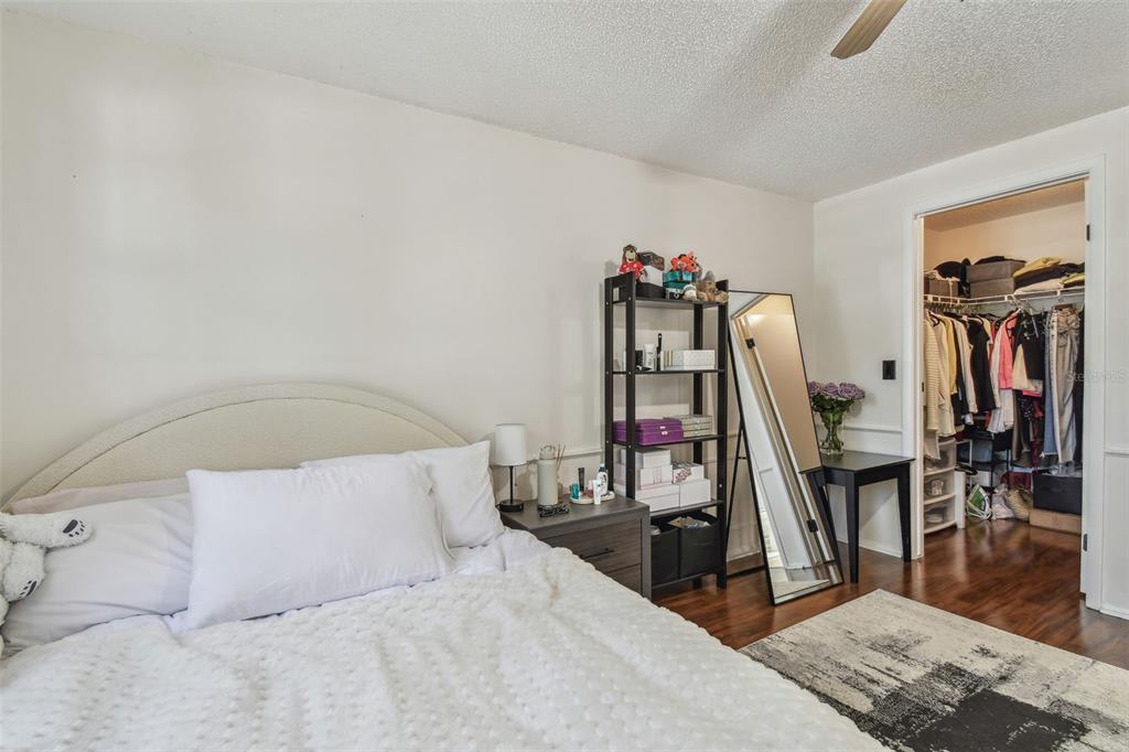 134 Sycamore Lane, Unit H Oldsmar, FL 34677 - Photo 17 of 44 a bed room with a bed and a wooden floor