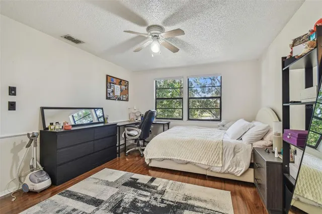 a bed room with a bed and a window