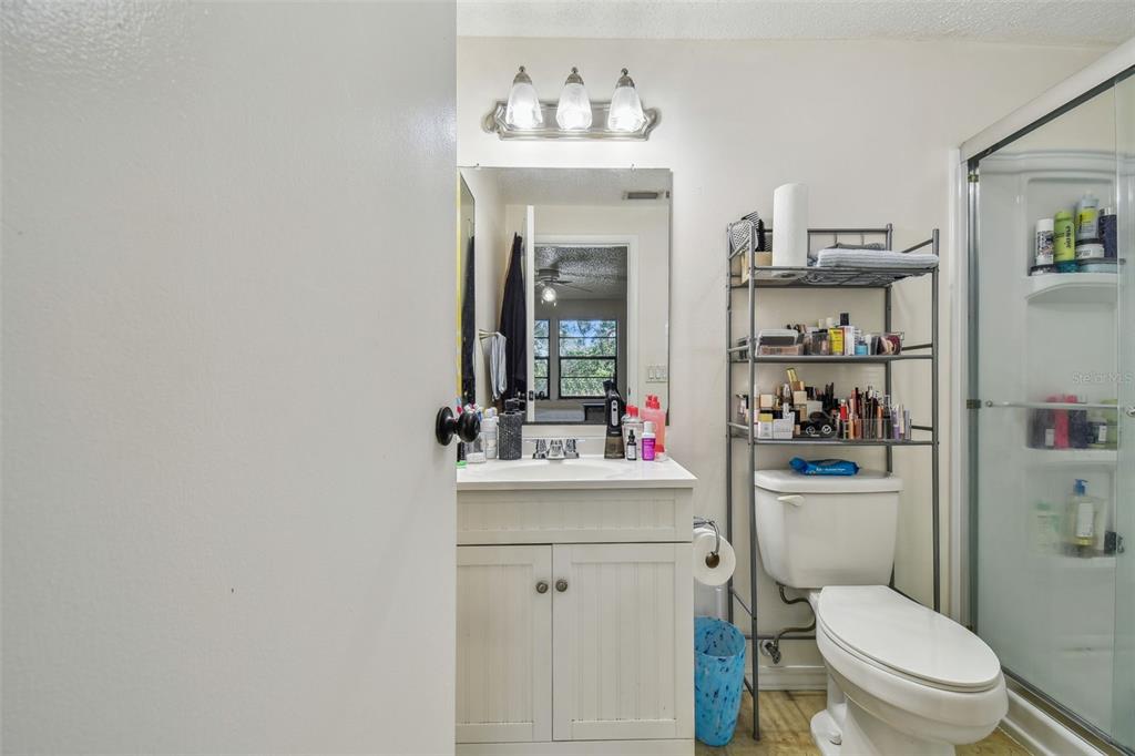 134 Sycamore Lane, Unit H Oldsmar, FL 34677 - Photo 19 of 44 a bathroom with a toilet sink and mirror
