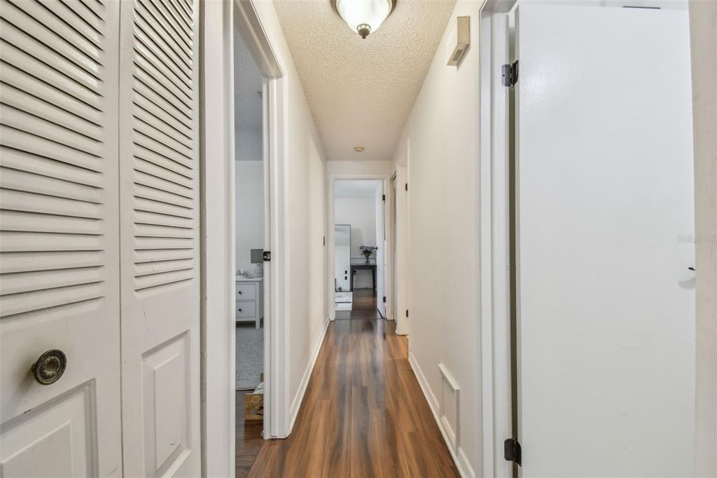 134 Sycamore Lane, Unit H Oldsmar, FL 34677 - Photo 24 of 44 a view of hallway with stairs and wooden floor