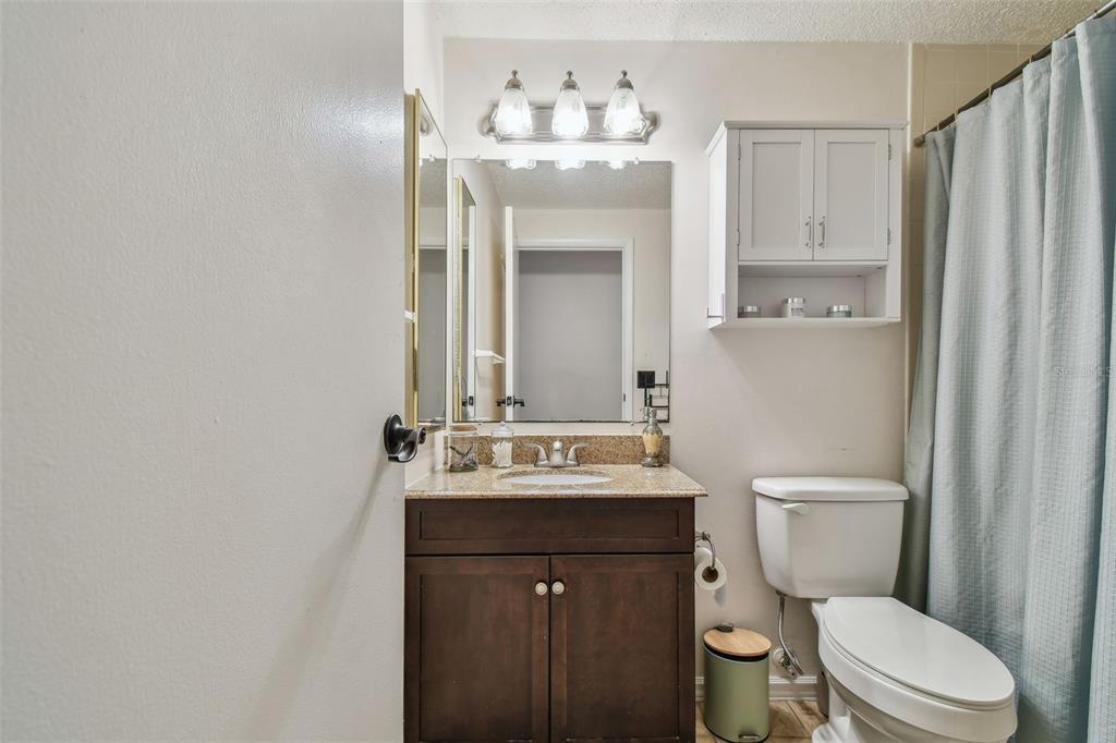 134 Sycamore Lane, Unit H Oldsmar, FL 34677 - Photo 26 of 44 a bathroom with a sink vanity mirror and toilet