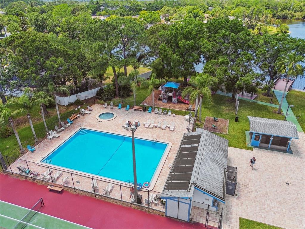 134 Sycamore Lane, Unit H Oldsmar, FL 34677 - Photo 40 of 44 an aerial view of a tennis ground with large trees