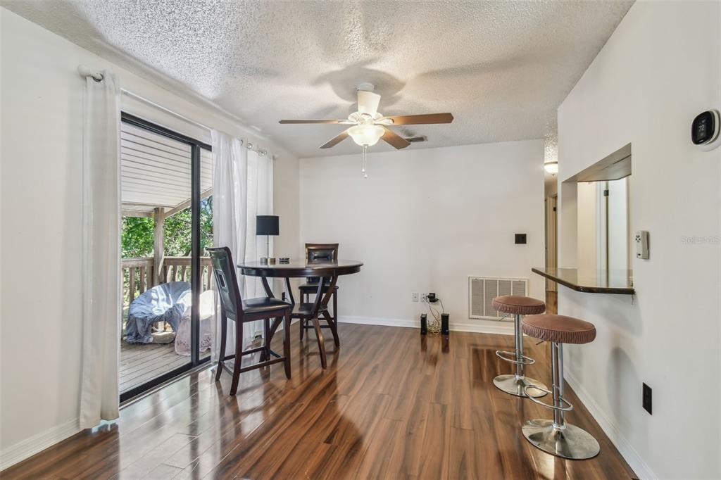 134 Sycamore Lane, Unit H Oldsmar, FL 34677 - Photo 4 of 44 a view of a dining room with furniture window and wooden floor
