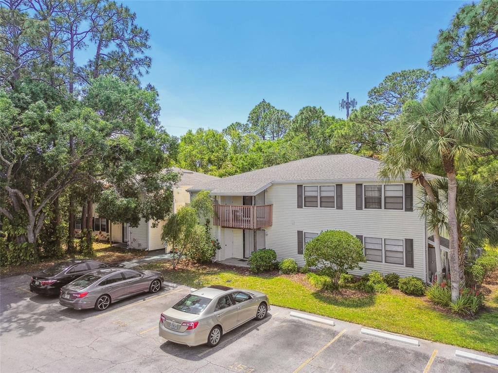 134 Sycamore Lane, Unit H Oldsmar, FL 34677 - Photo 44 of 44 a front view of a house with a yard and garage