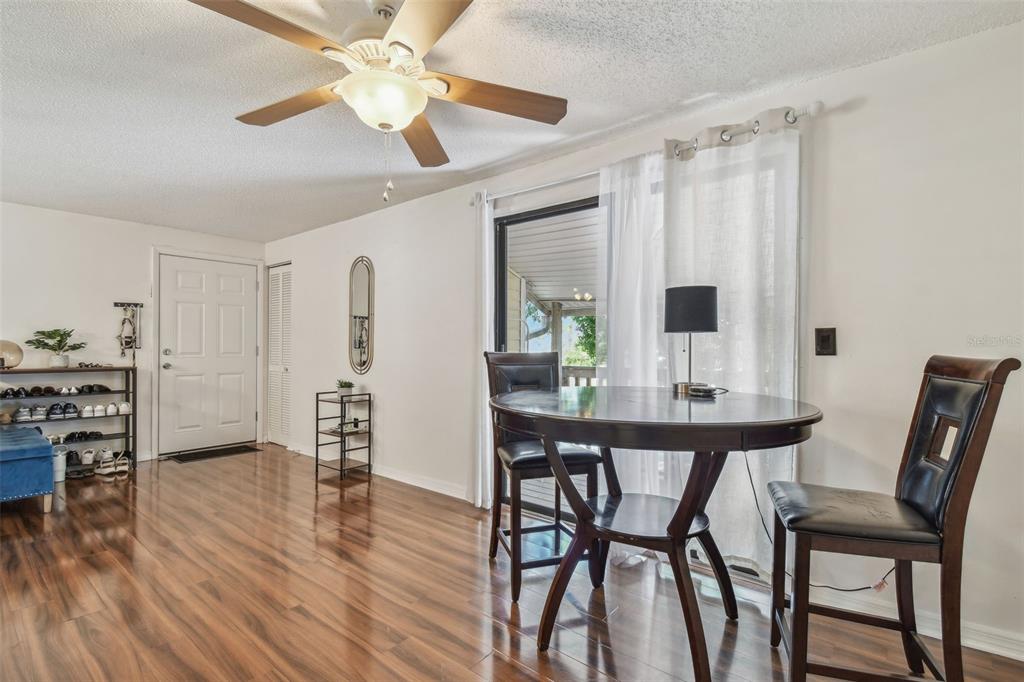 134 Sycamore Lane, Unit H Oldsmar, FL 34677 - Photo 5 of 44 a view of a dining room with furniture and wooden floor