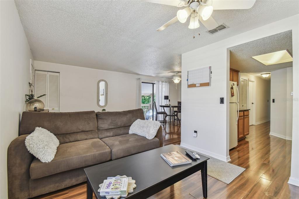 134 Sycamore Lane, Unit H Oldsmar, FL 34677 - Photo 8 of 44 a living room with furniture and wooden floor
