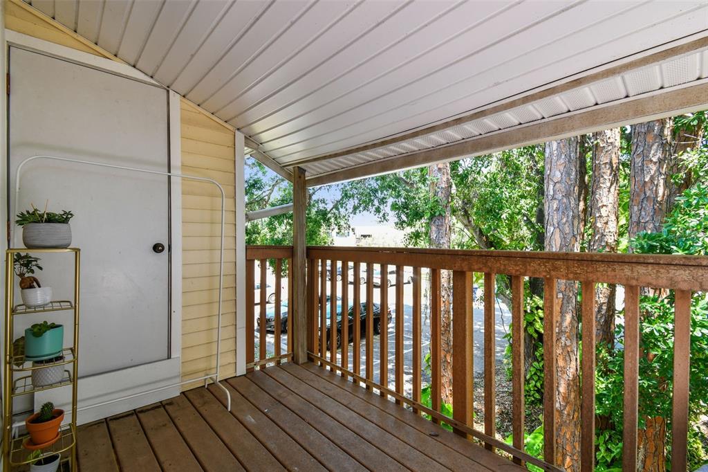 134 Sycamore Lane, Unit H Oldsmar, FL 34677 - Photo 10 of 44 a view of a porch with wooden floor