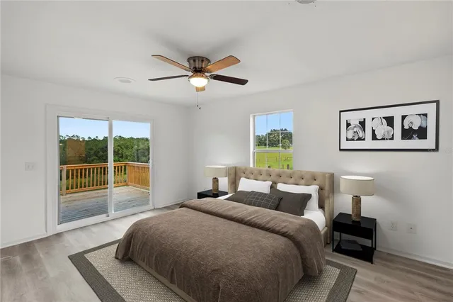 a bedroom with a large bed and a large window