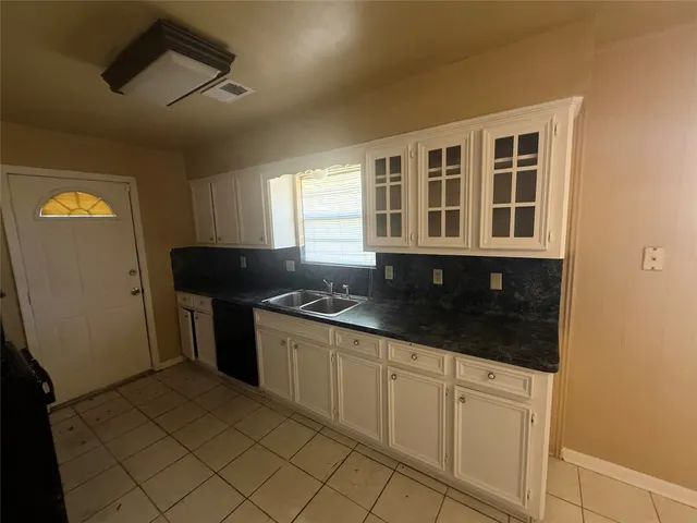 a kitchen with stainless steel appliances granite countertop a stove and a sink
