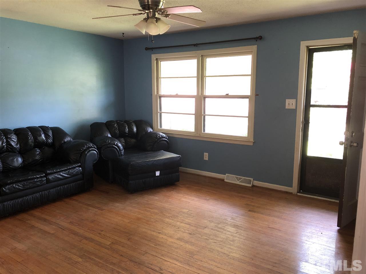 303 Lancaster Road Mebane, NC 27302 - Photo 3 of 9 a living room with furniture and a window