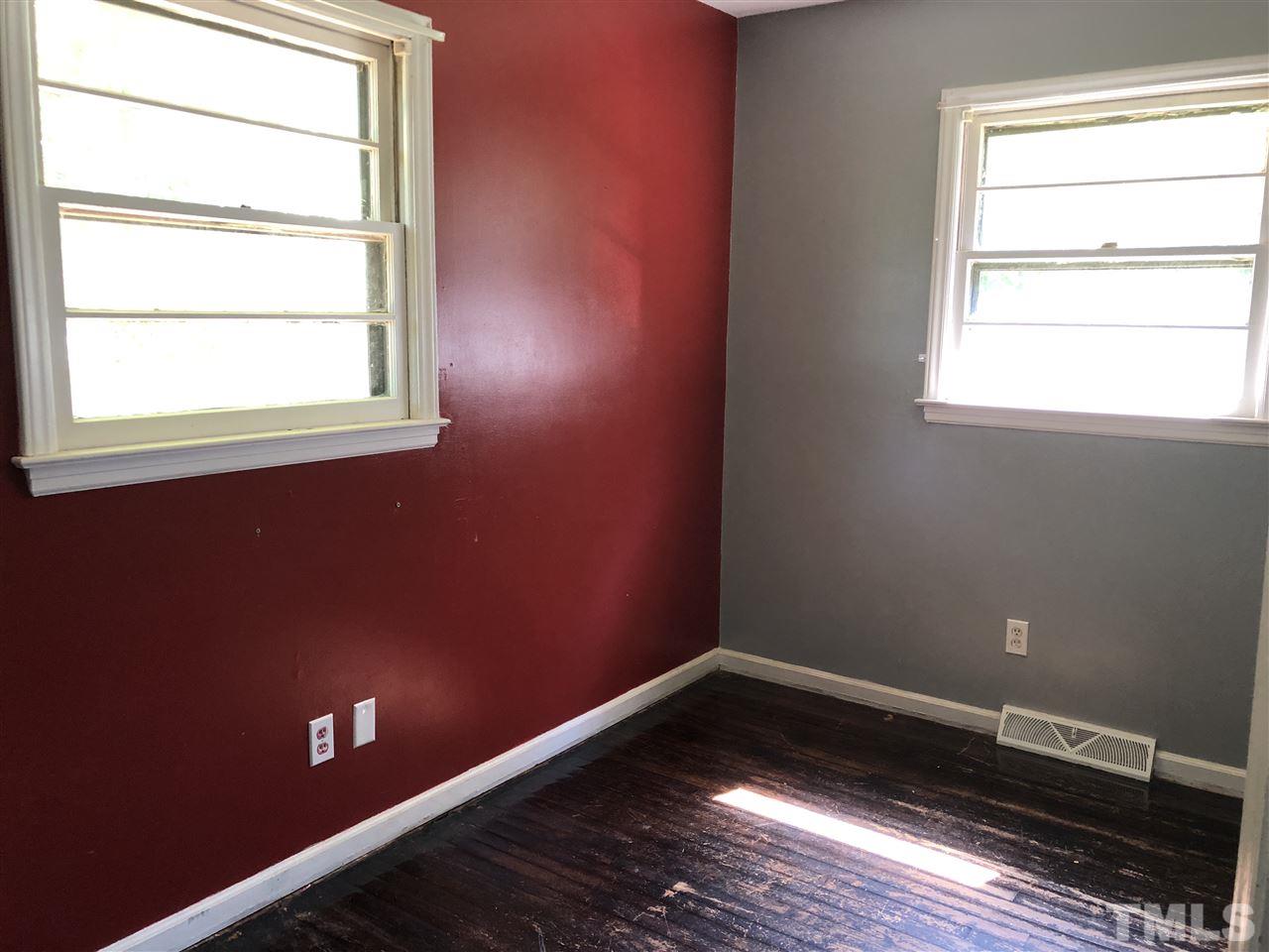 303 Lancaster Road Mebane, NC 27302 - Photo 8 of 9 a view of a room with wooden floor and windows