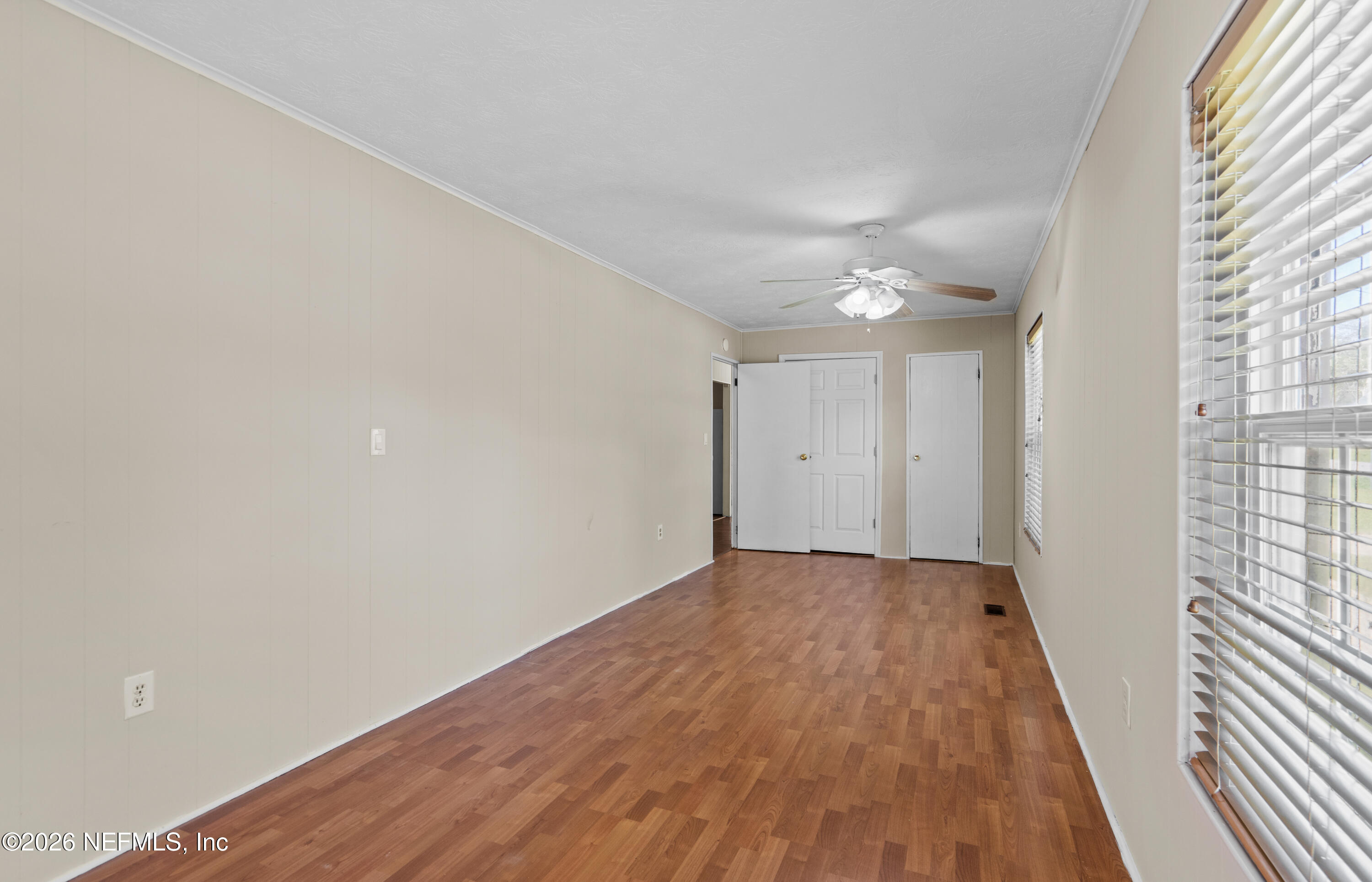 253 Cowry Road St. Augustine, FL 32086 - Photo 14 of 27 a view of a big room with wooden floor and windows