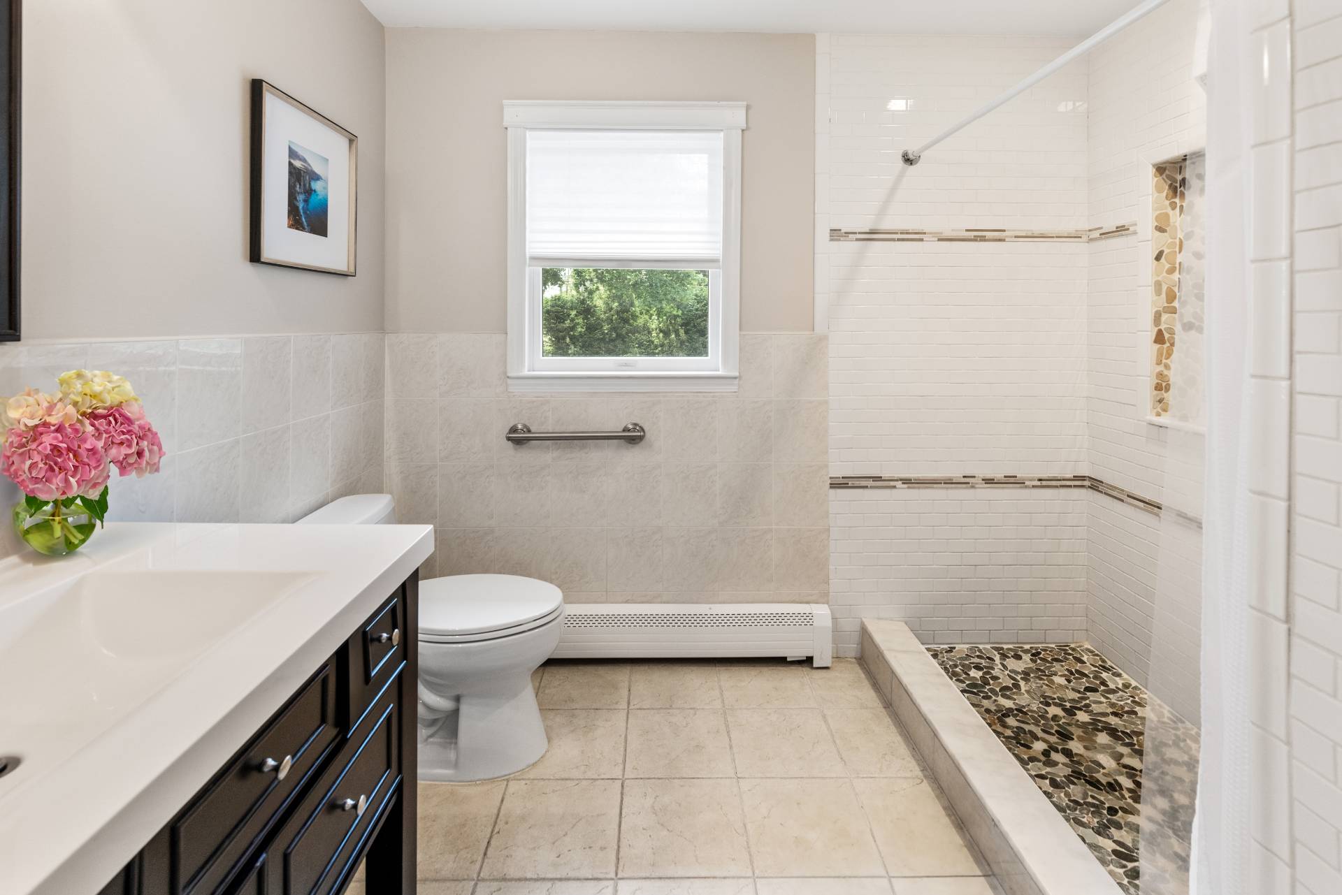 43 Shinnecock Road Hampton Bays, NY 11946 - Photo 11 of 17 a bathroom with a sink a toilet and shower