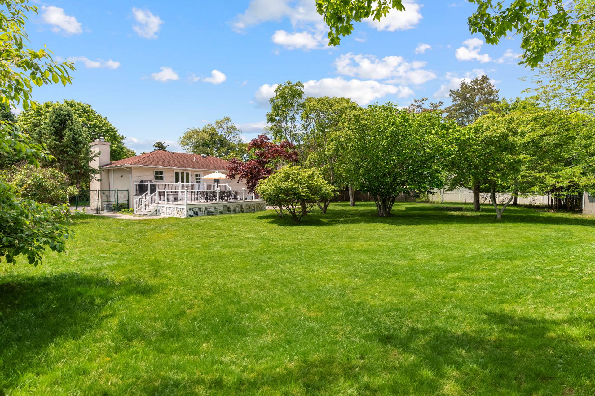 43 Shinnecock Road Hampton Bays, NY 11946 - Photo 2 of 17 a view of house with a garden