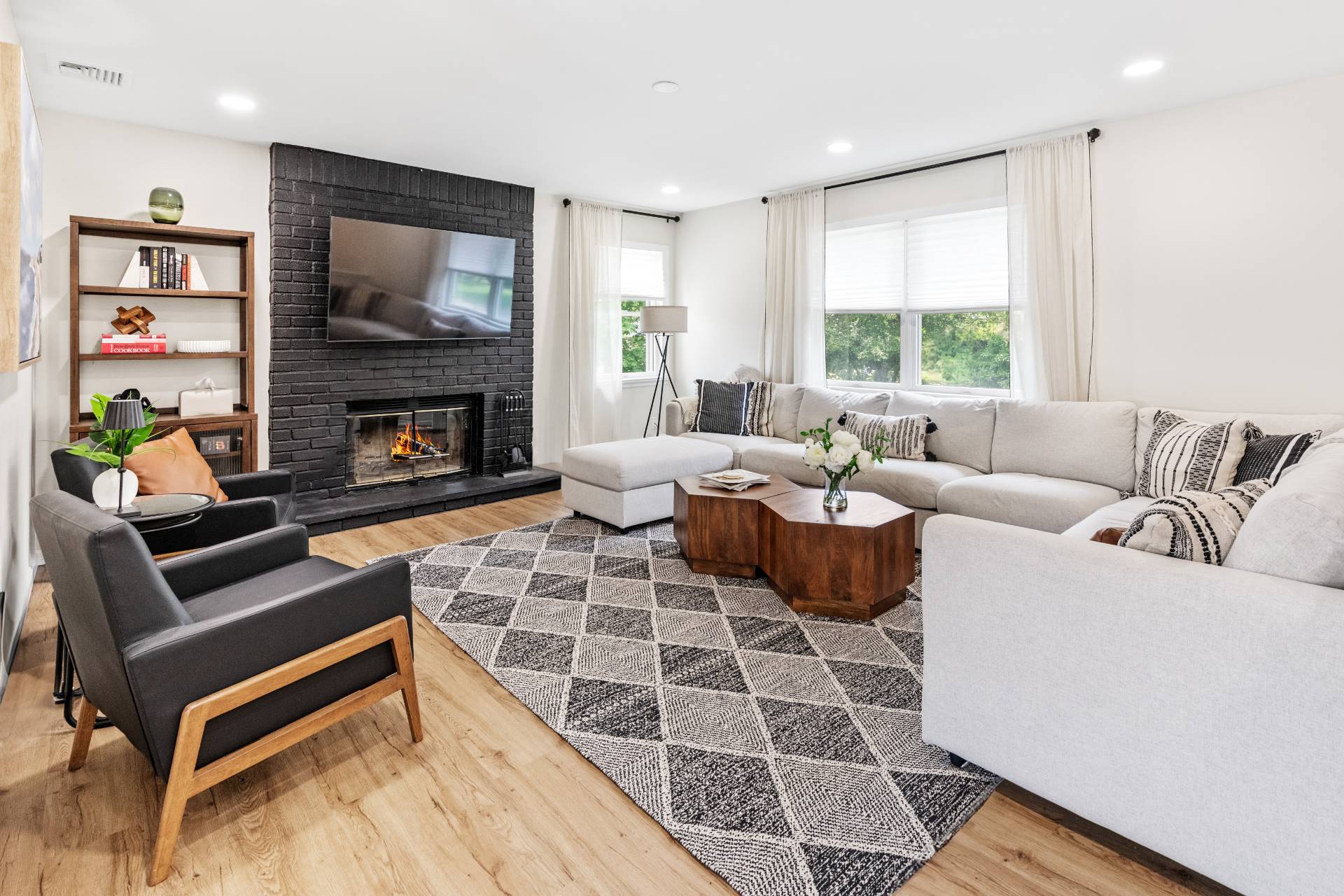 43 Shinnecock Road Hampton Bays, NY 11946 - Photo 5 of 17 a living room with furniture fireplace and a flat screen tv