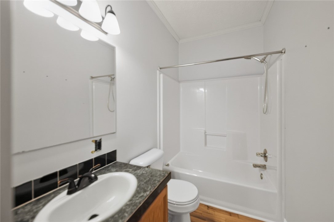 564 Fairfield Road Walhalla, SC 29691 - Photo 25 of 50 Functional bathroom design incorporates a practical tub-and-shower combination alongside a laminate vanity.