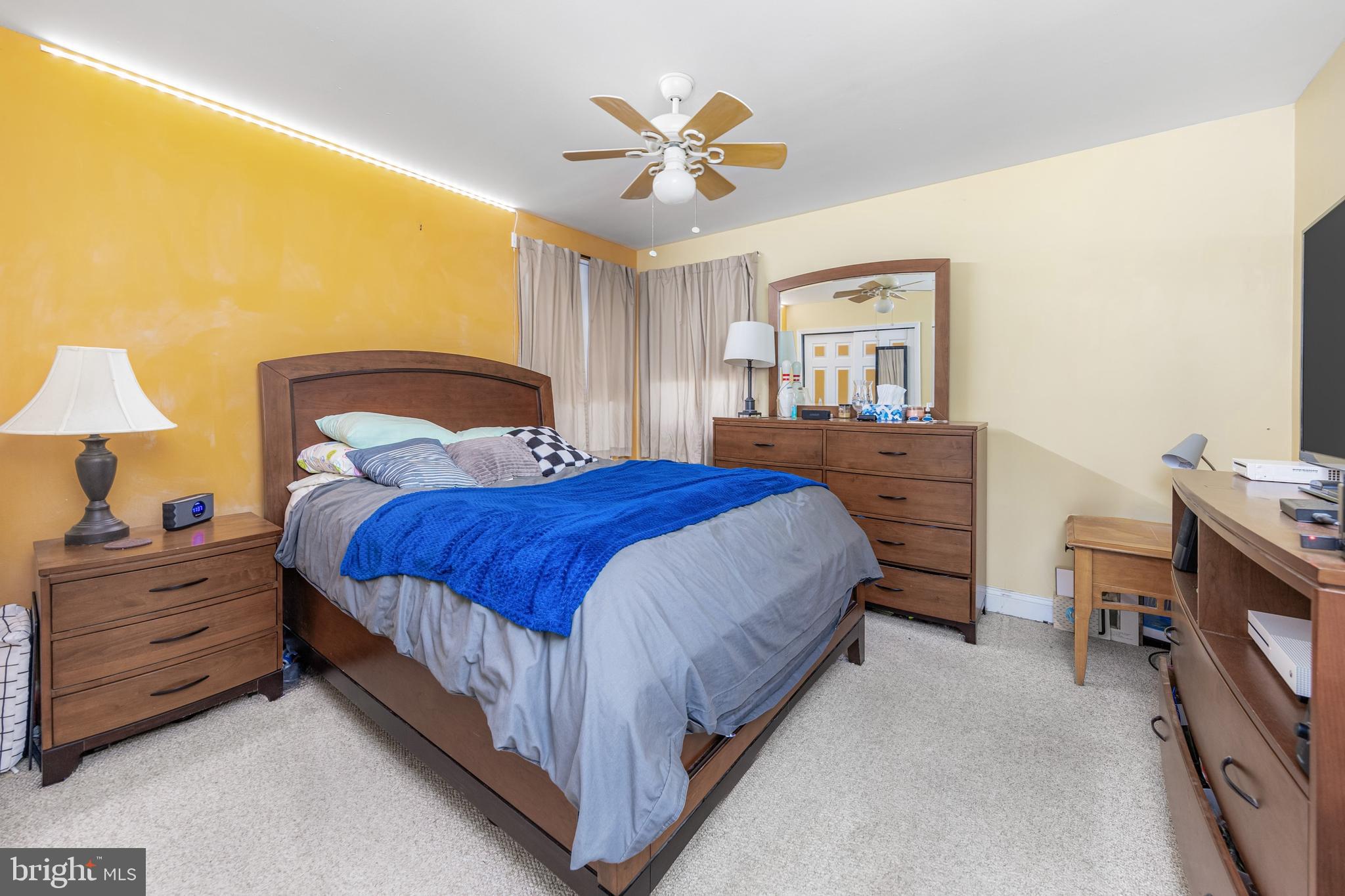 29 Peach Ridge Drive Mullica Hill, NJ 08062 - Photo 21 of 31 a bedroom with a bed and a chandelier