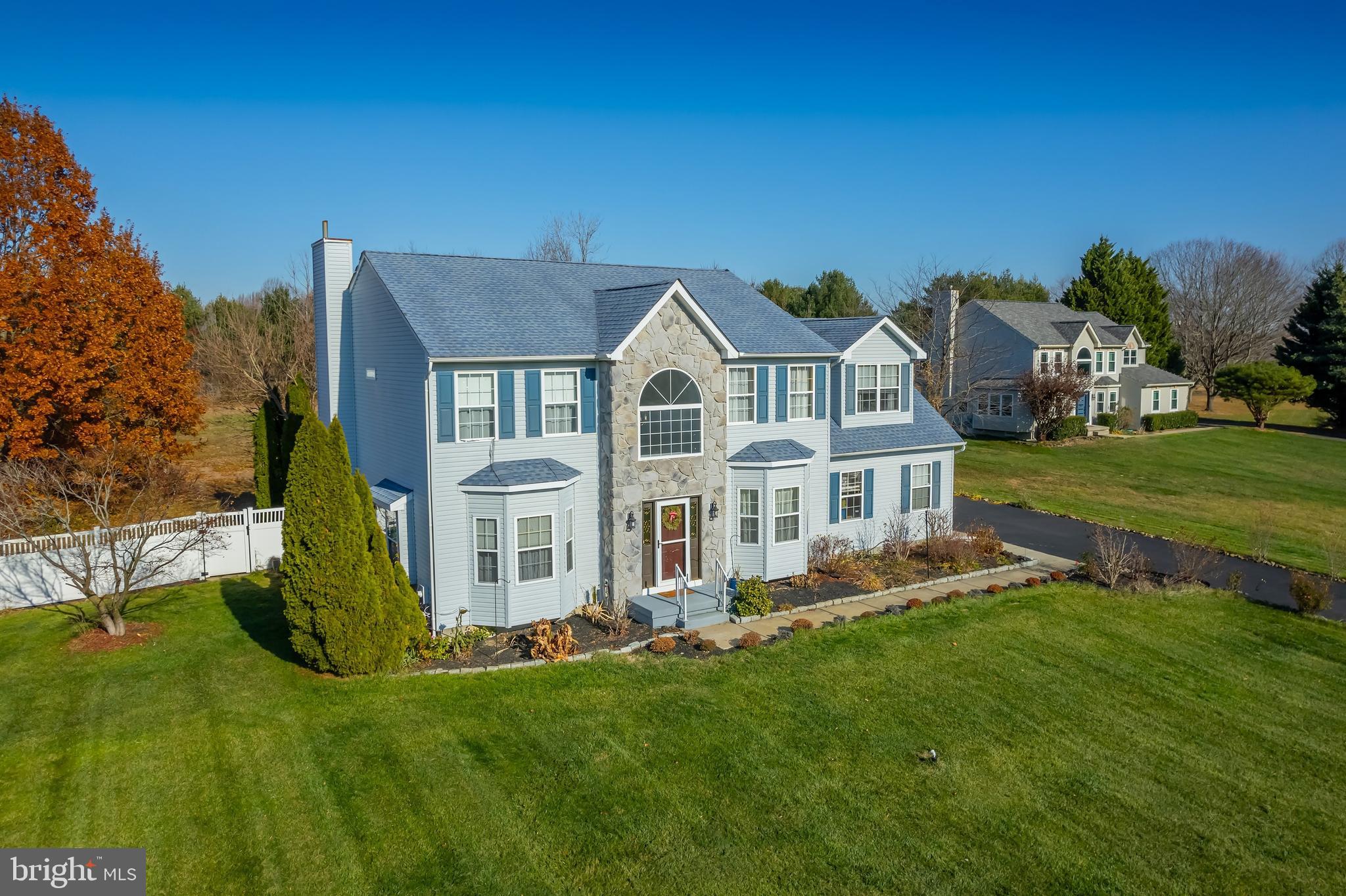 29 Peach Ridge Drive Mullica Hill, NJ 08062 - Photo 4 of 31 a front view of a house with a garden