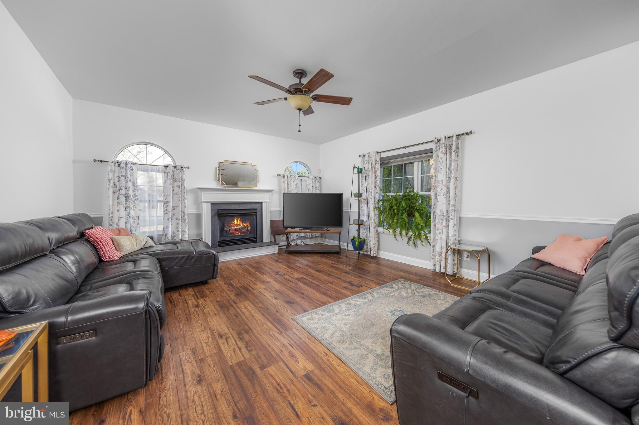 29 Peach Ridge Drive Mullica Hill, NJ 08062 - Photo 9 of 31 a living room with furniture fireplace and a flat screen tv