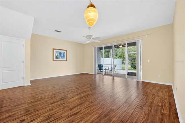a view of an entryway with wooden floor