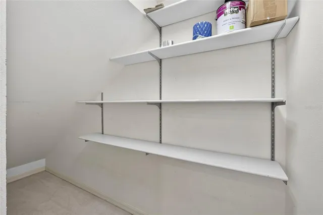 a bathroom with a granite countertop toilet a sink and a mirror