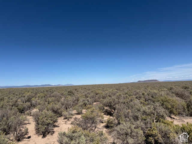 350 West Antelope Springs Road Beryl, UT 84714 - Photo 8 of 14 Expansive open terrain with natural brush, distant mountains, and clear blue sky