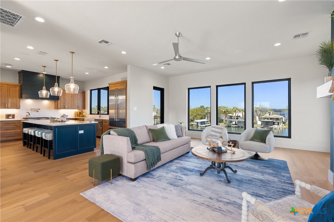 175 Pointview Drive Marble Falls, TX 78654 - Photo 13 of 34 a living room with furniture kitchen view and a large window