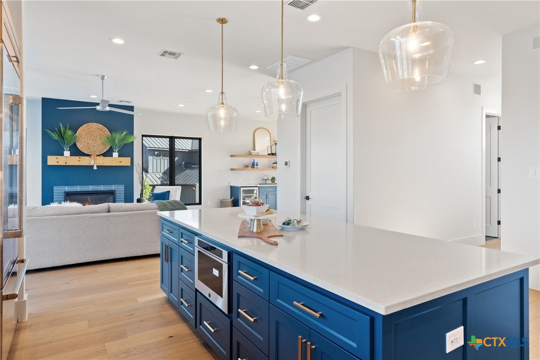 175 Pointview Drive Marble Falls, TX 78654 - Photo 21 of 34 a large kitchen with kitchen island a large center island in it