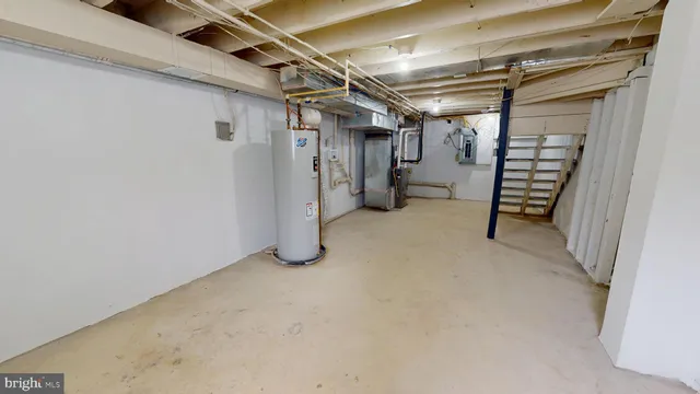 a view of empty room with wooden walls