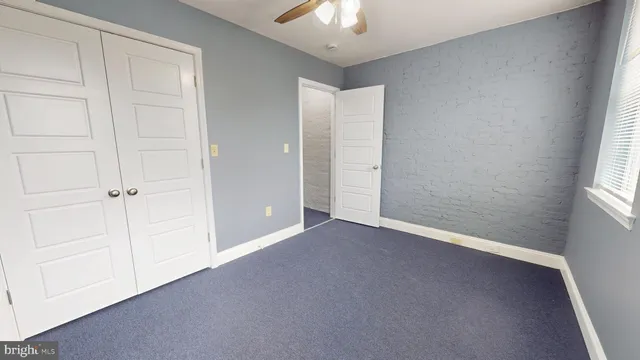 an empty room with a empty space and windows