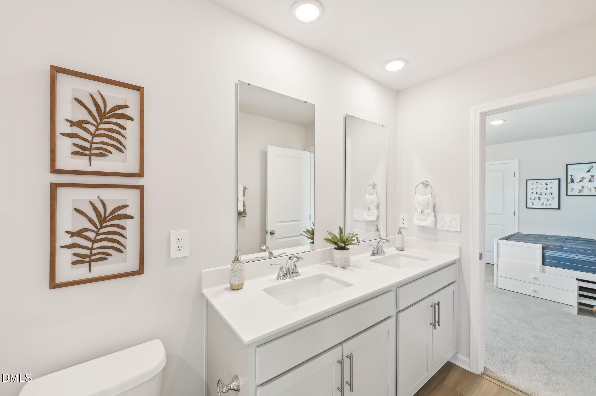 924 Broadleaf Trace Mebane, NC 27302 - Photo 24 of 26 a bathroom with a sink and a mirror