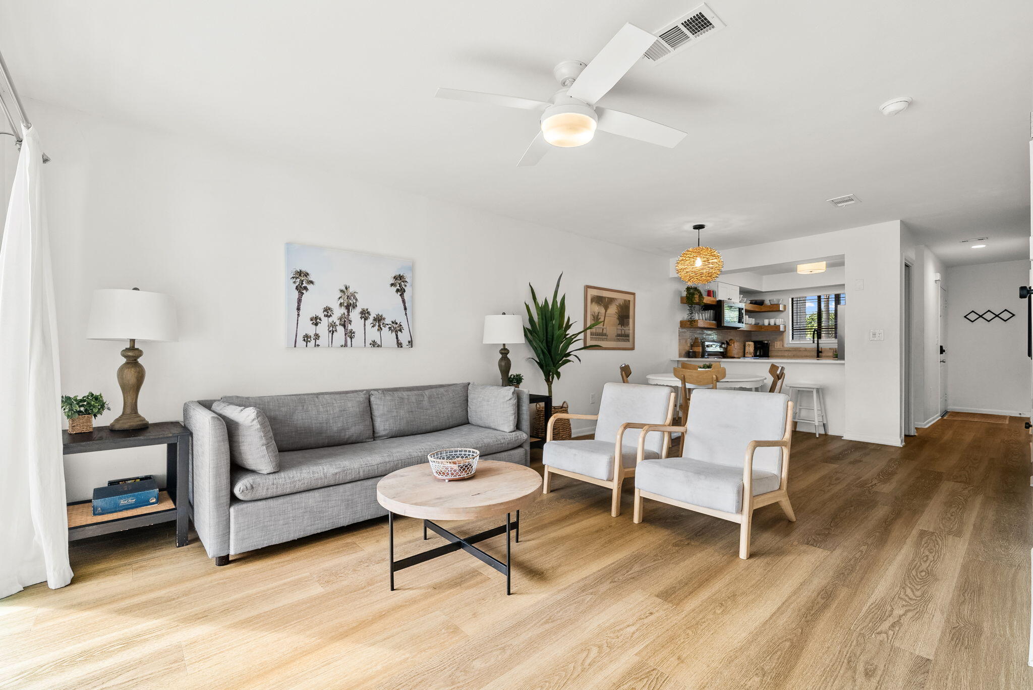 17620 Front Beach Road, Unit J2 Panama City Beach, FL 32413 - Photo 1 of 30 a living room with furniture and wooden floor