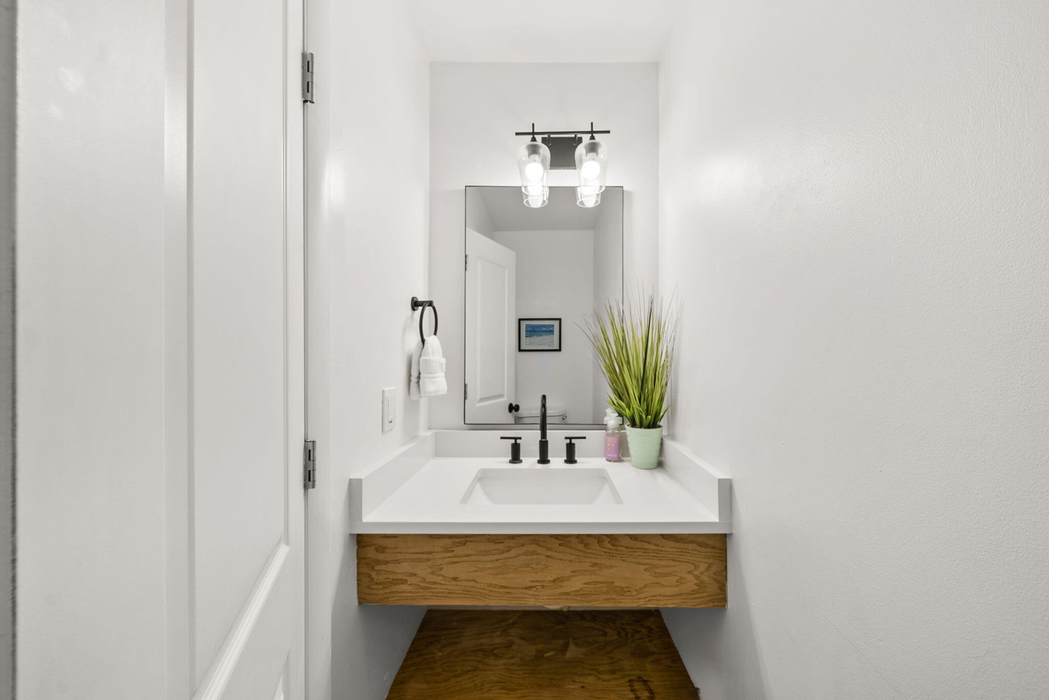 17620 Front Beach Road, Unit J2 Panama City Beach, FL 32413 - Photo 11 of 30 a bathroom with a sink and a mirror