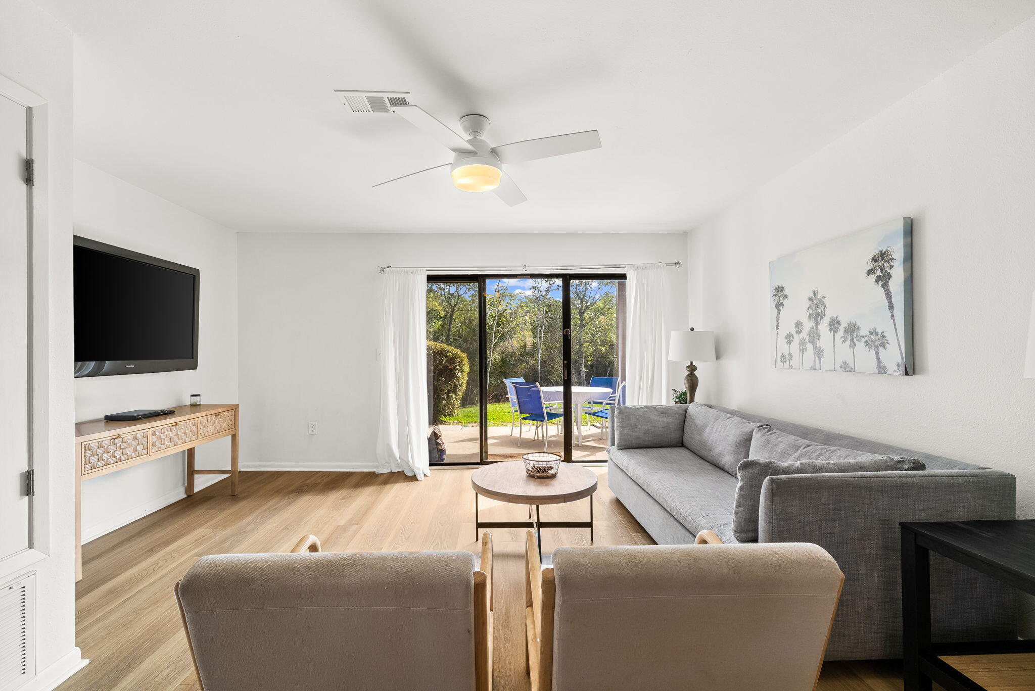 17620 Front Beach Road, Unit J2 Panama City Beach, FL 32413 - Photo 14 of 30 a living room with furniture and a flat screen tv