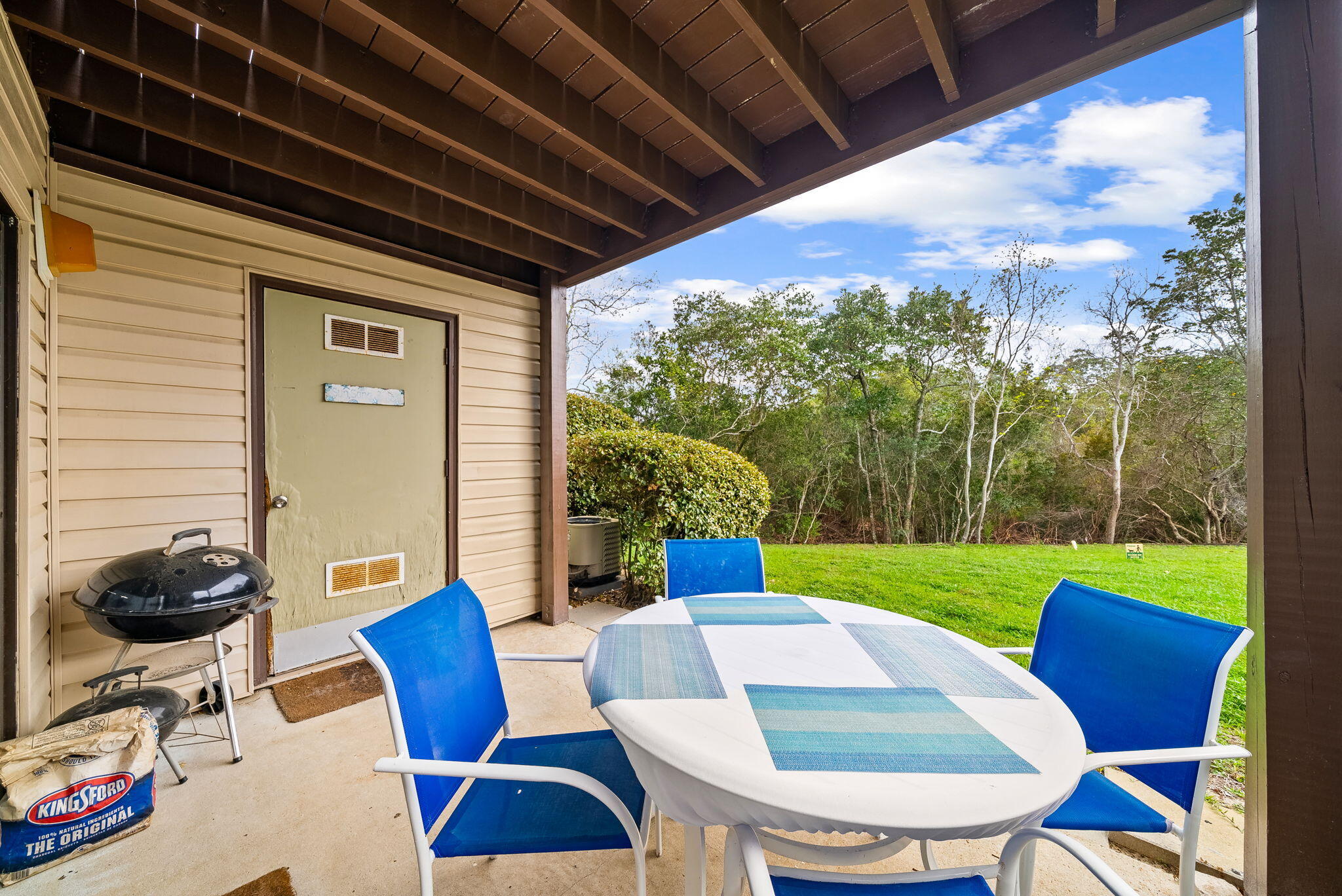 17620 Front Beach Road, Unit J2 Panama City Beach, FL 32413 - Photo 17 of 30 a view of a porch with furniture and a yard