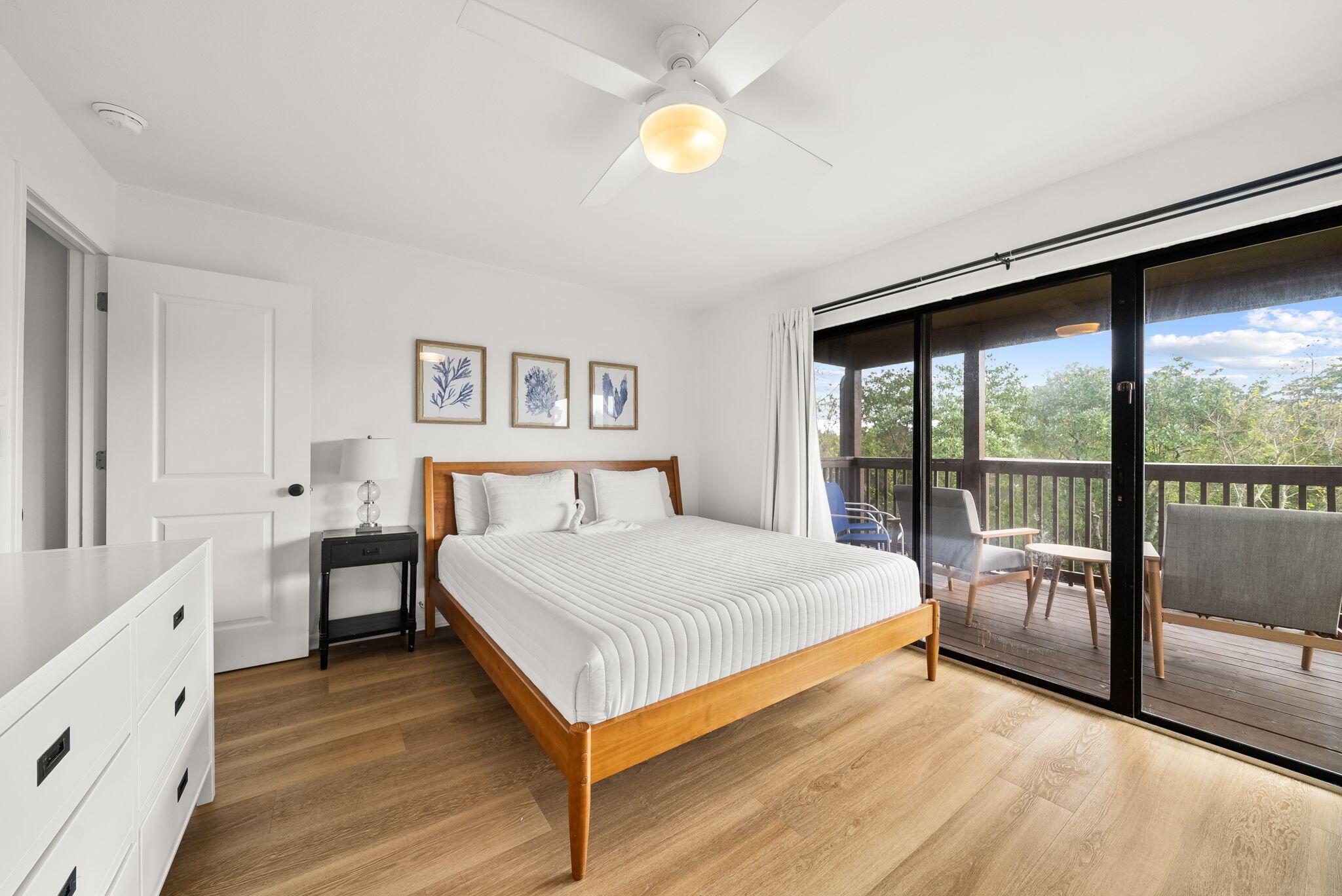 17620 Front Beach Road, Unit J2 Panama City Beach, FL 32413 - Photo 3 of 30 a bedroom with a bed and a lamp next to a window