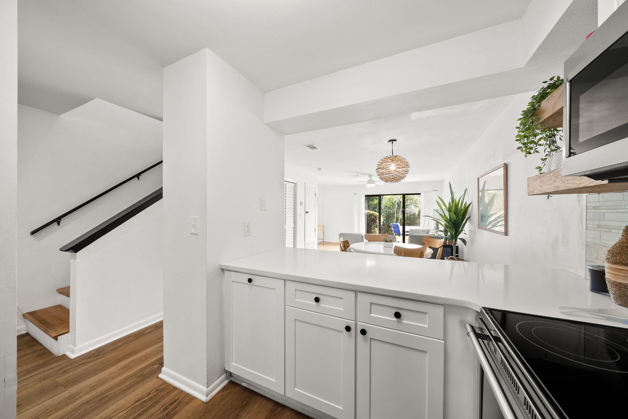 17620 Front Beach Road, Unit J2 Panama City Beach, FL 32413 - Photo 10 of 30 a hallway with sink and mirror