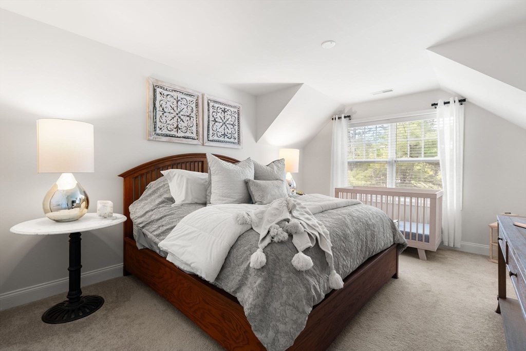 2 Hummingbird Way, Unit 1 Methuen, MA 01844 - Photo 27 of 42 a bedroom with a bed and a window