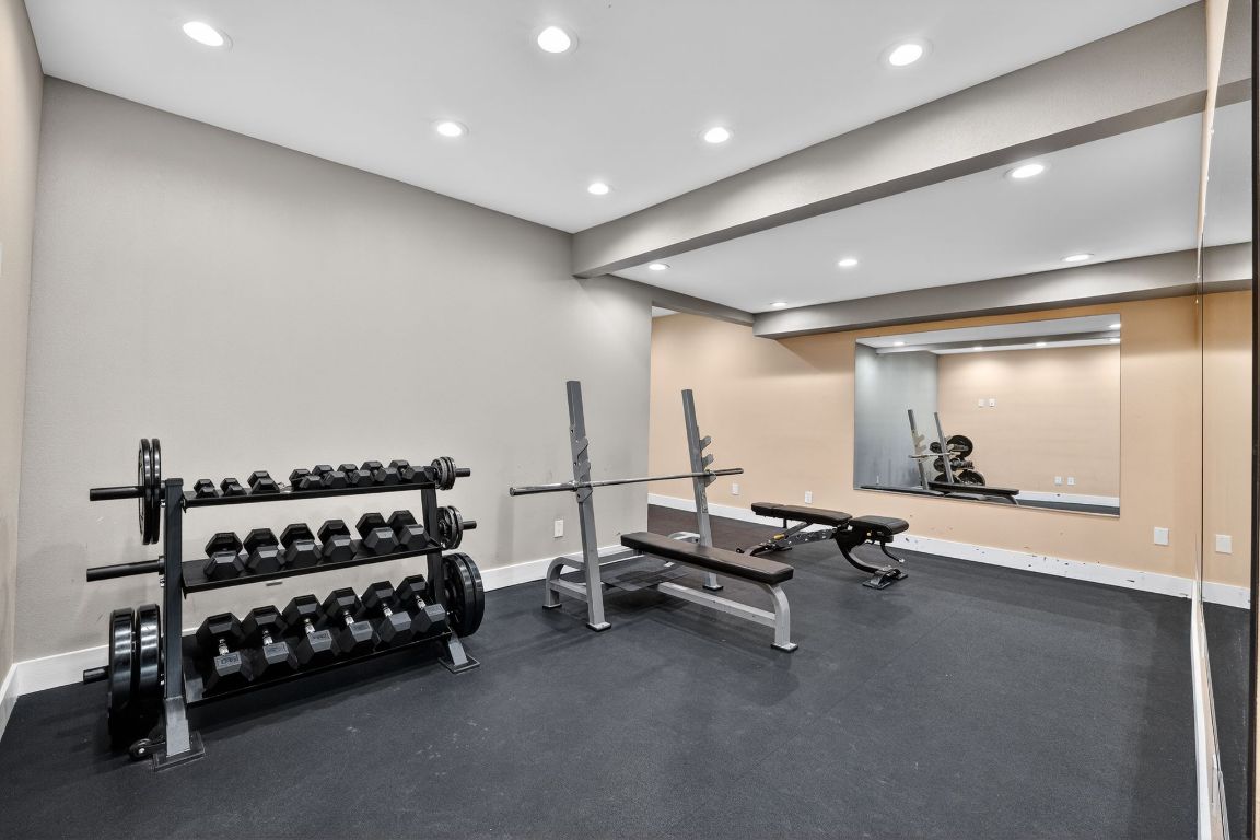 935 La Posada Drive, Unit 128 Austin, TX 78752 - Photo 17 of 18 a view of a room with gym equipment