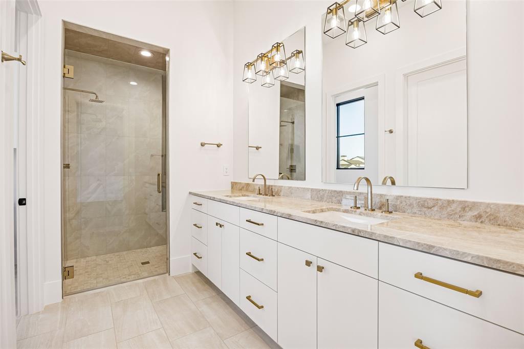 1410 Clydesdale Road Argyle, TX 76226 - Photo 23 of 40 a bathroom with double sink and a mirror