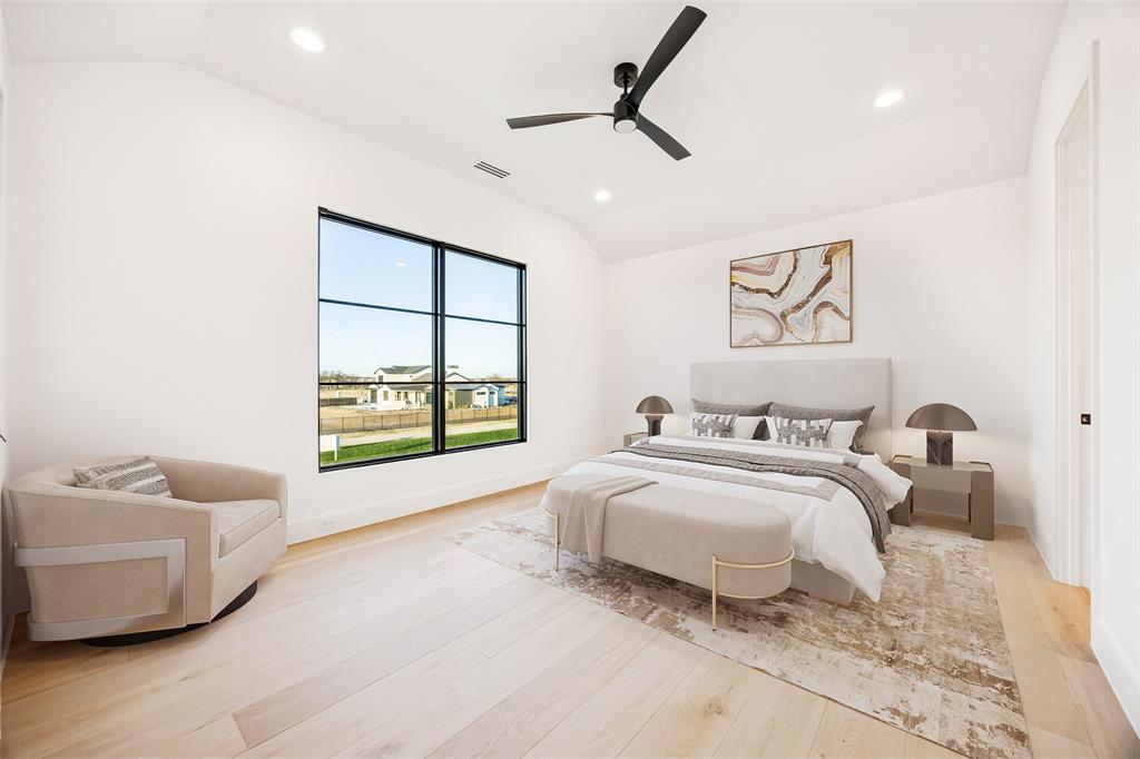 1410 Clydesdale Road Argyle, TX 76226 - Photo 26 of 40 a spacious bedroom with a bed and a couch