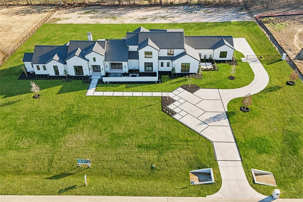 1410 Clydesdale Road Argyle, TX 76226 - Photo 3 of 40 an aerial view of a house with a swimming pool