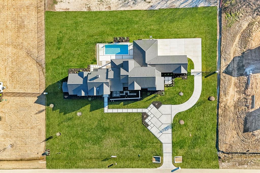 1410 Clydesdale Road Argyle, TX 76226 - Photo 4 of 40 an aerial view of a house with a garden and trees